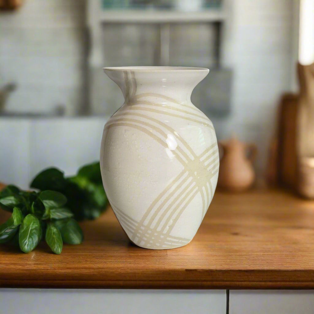 
                      
                        Medium white gloss vase with clear lines. 
                      
                    