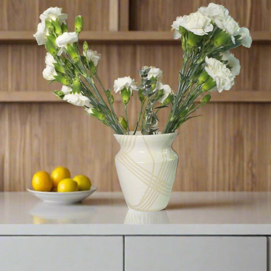 
                      
                        Medium white gloss vase with clear lines with white flowers
                      
                    