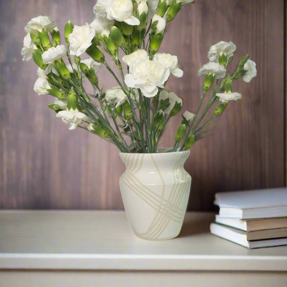 
                      
                        Medium white gloss vase with clear lines. with white flowers
                      
                    